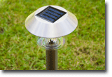 Picture of solar outdoor lighting showiing the solar panel on top.