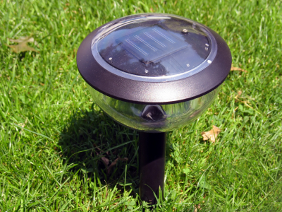 Picture of a low solar light showing the solar panel on top.